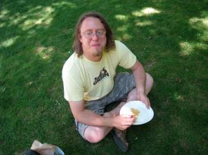 john stuffing himself at the farmers market